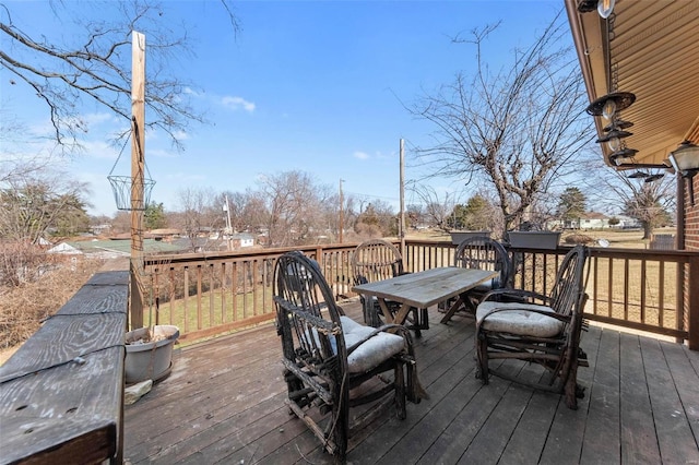 wooden deck with outdoor dining area