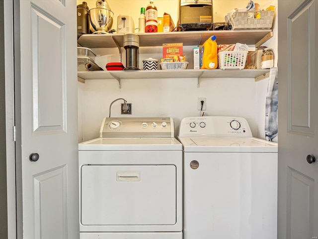 washroom with laundry area and washer and clothes dryer