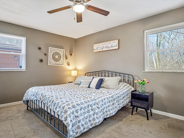 bedroom featuring multiple windows, baseboards, and carpet floors