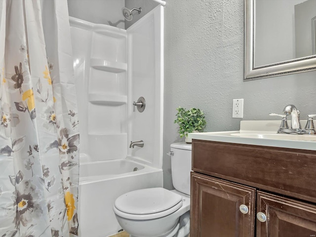 bathroom featuring vanity, shower / tub combo, toilet, and a textured wall