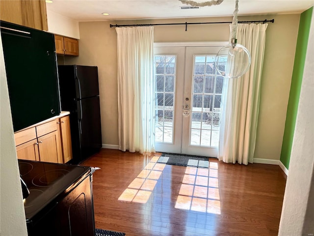 entryway with visible vents, french doors, baseboards, and dark wood-style flooring