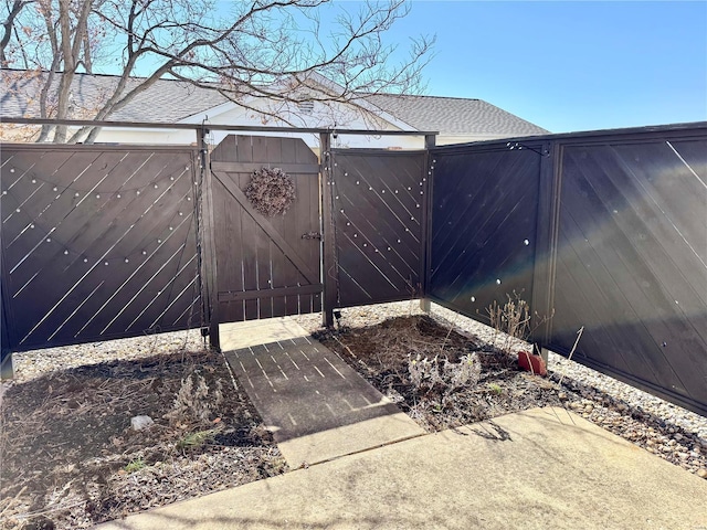 view of gate with fence