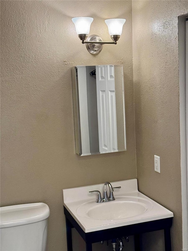 half bath with toilet and vanity