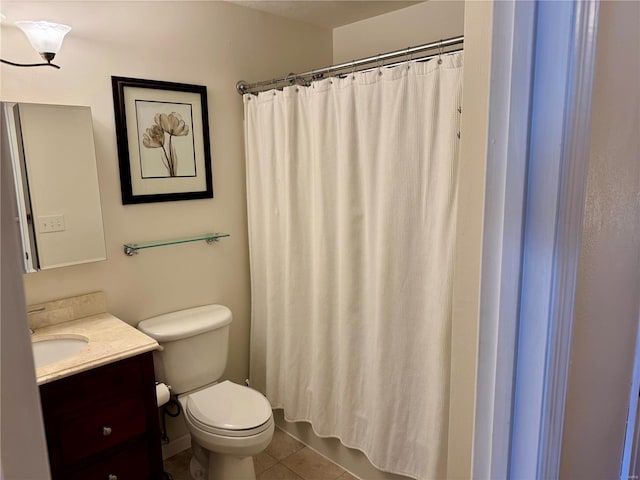 bathroom featuring tile patterned flooring, a shower with shower curtain, toilet, and vanity