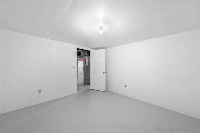 empty room with finished concrete flooring