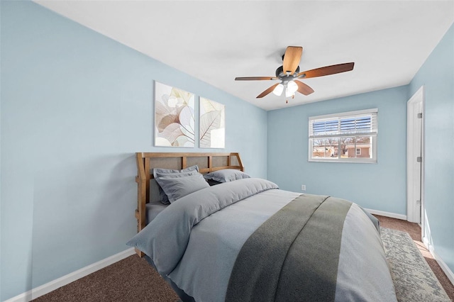 carpeted bedroom featuring baseboards and ceiling fan