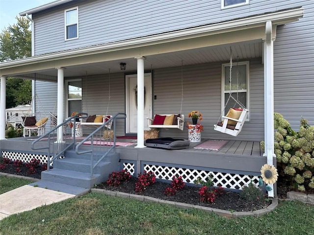 property entrance featuring a porch