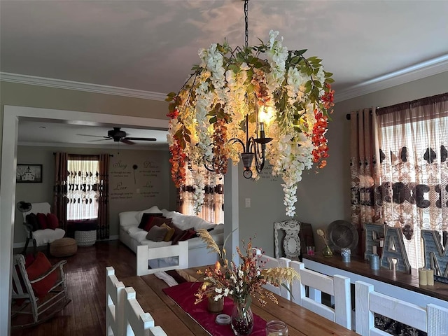 dining room featuring ceiling fan, crown molding, and wood finished floors