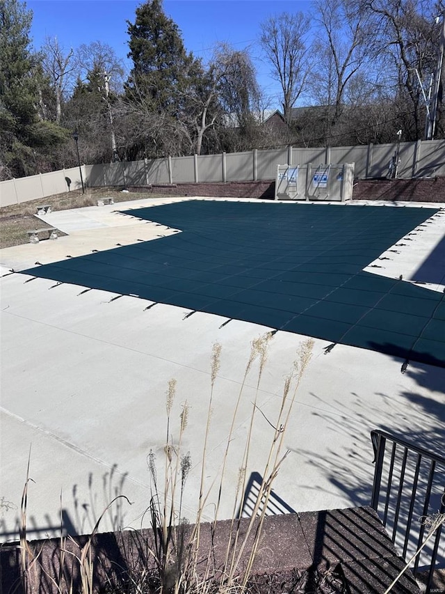 view of pool with a fenced in pool, a patio area, and fence