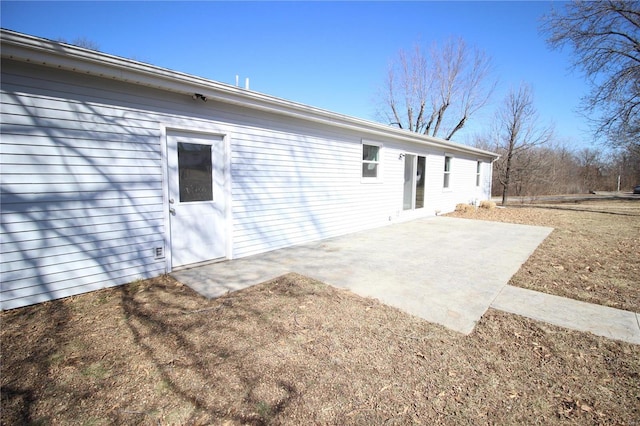 back of house with a patio