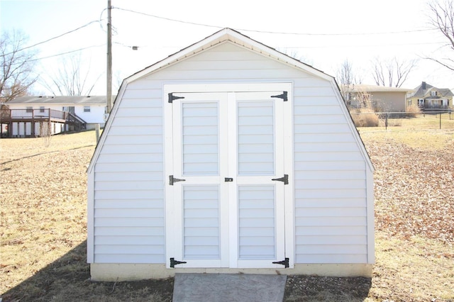 view of shed with fence