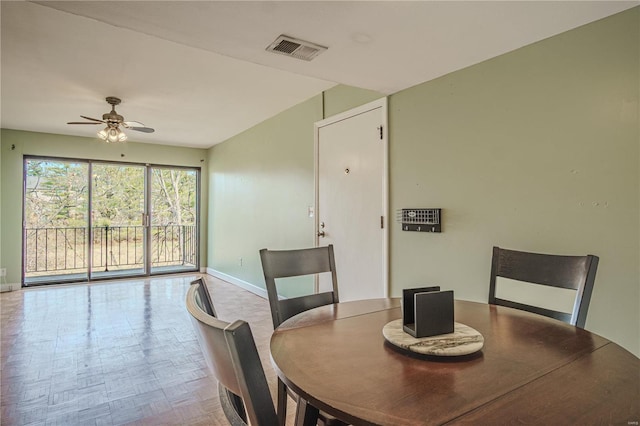 dining space featuring visible vents, baseboards, and a ceiling fan