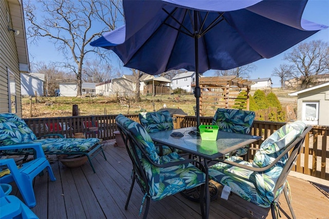 wooden deck with outdoor dining area