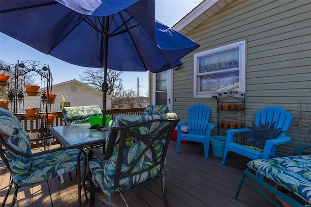 deck featuring outdoor dining area