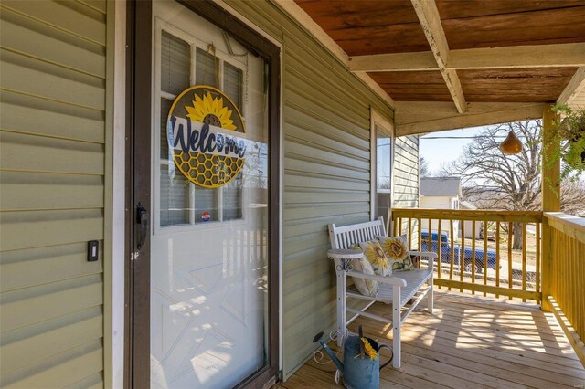 doorway to property featuring a porch