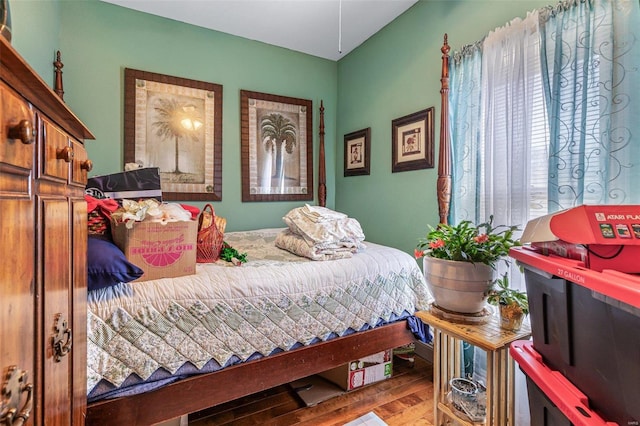 bedroom featuring wood finished floors