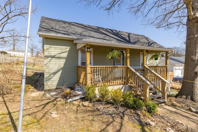 view of front of home featuring a porch and a shingled roof