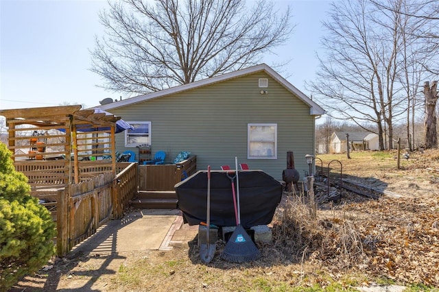 view of outdoor structure with a pergola