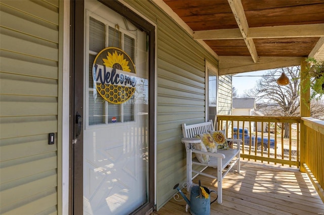 view of exterior entry with a porch