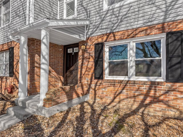 view of home's exterior with brick siding