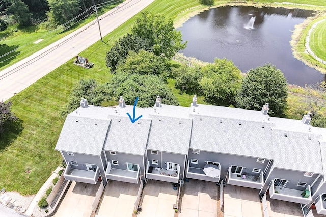 birds eye view of property with a water view