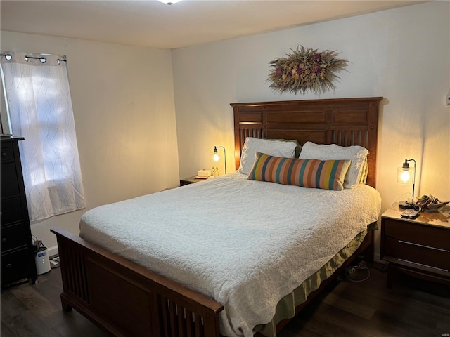 bedroom featuring dark wood-style flooring