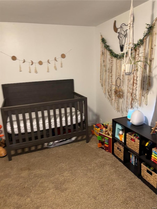 carpeted bedroom with a nursery area