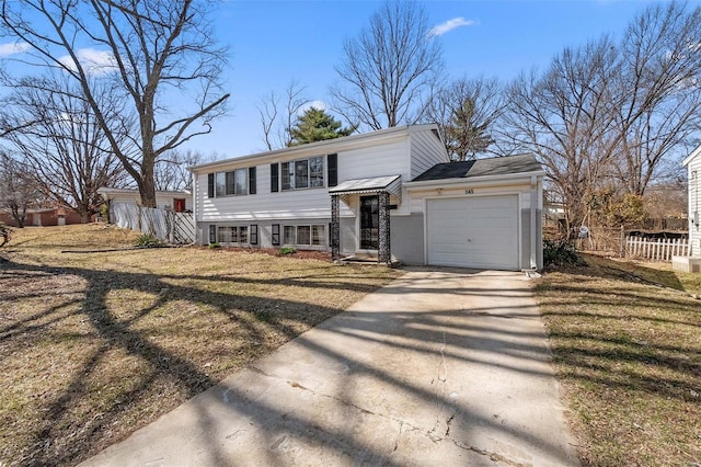 view of front of home with a garage, concrete driveway, a front lawn, and fence