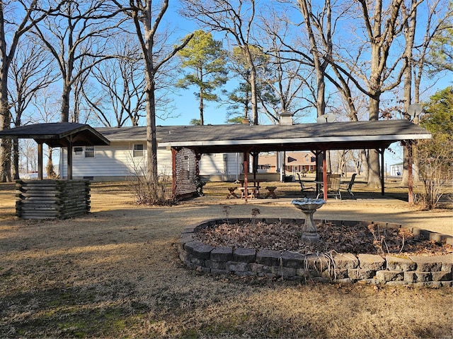 exterior space featuring a carport and a patio