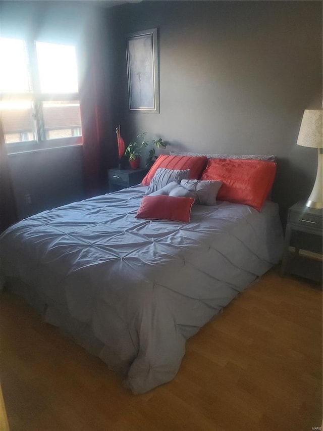 bedroom featuring wood finished floors