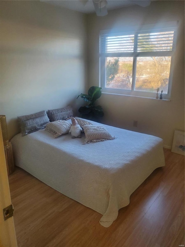 bedroom with wood finished floors