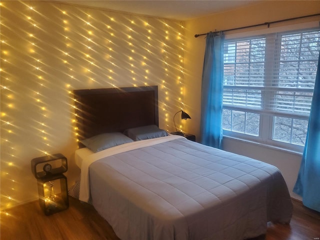 bedroom featuring wood finished floors