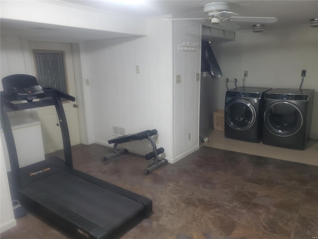 workout area with visible vents, ceiling fan, and separate washer and dryer