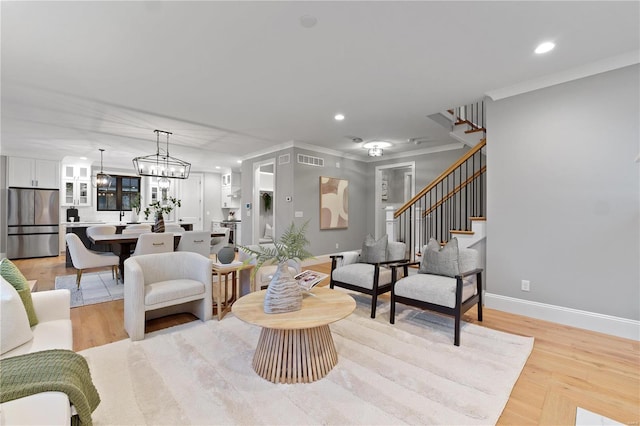 living area with light wood-type flooring, stairway, baseboards, and recessed lighting