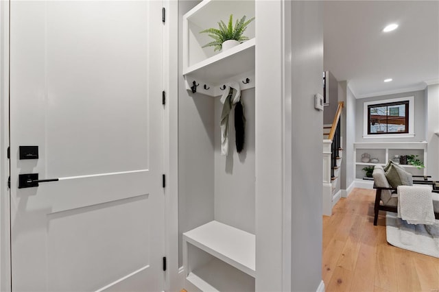 mudroom with light wood-style flooring, recessed lighting, and ornamental molding