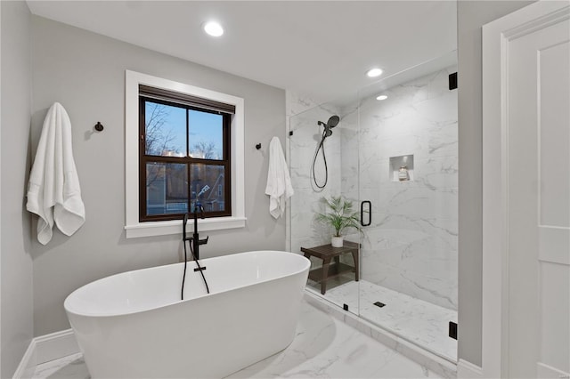 full bath with baseboards, a marble finish shower, a soaking tub, recessed lighting, and marble finish floor