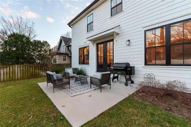 view of patio / terrace featuring french doors, grilling area, outdoor lounge area, and fence