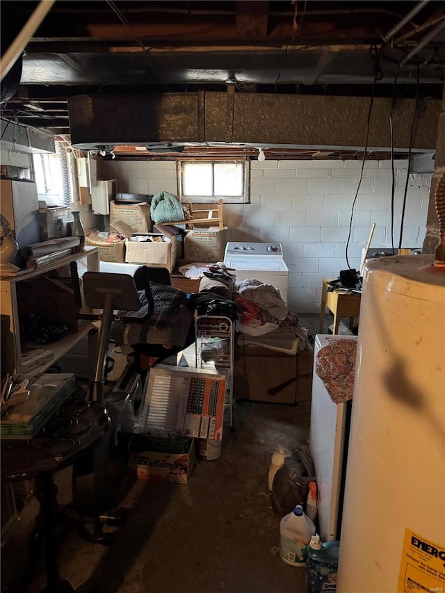 garage with concrete block wall and gas water heater
