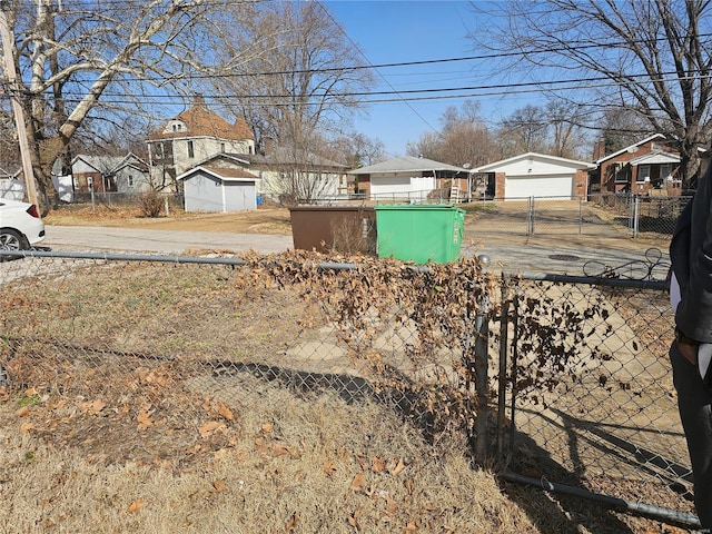 view of yard with a residential view and fence