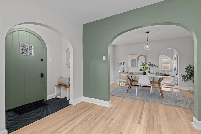 entrance foyer with wood finished floors and baseboards