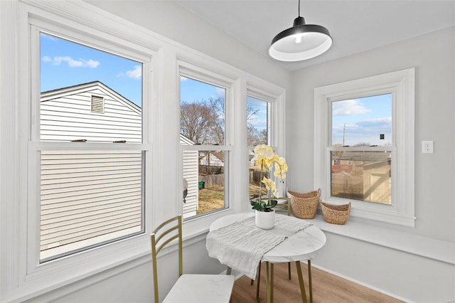 dining area featuring wood finished floors and baseboards