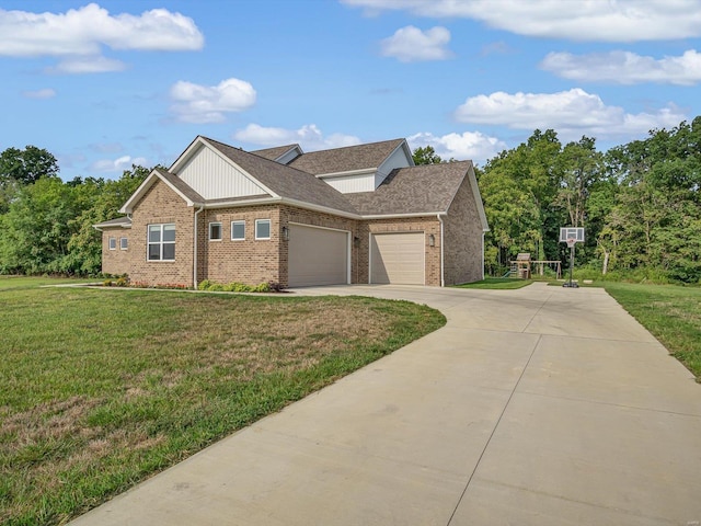 view of front of property featuring brick siding, a front yard, concrete driveway, and an attached garage