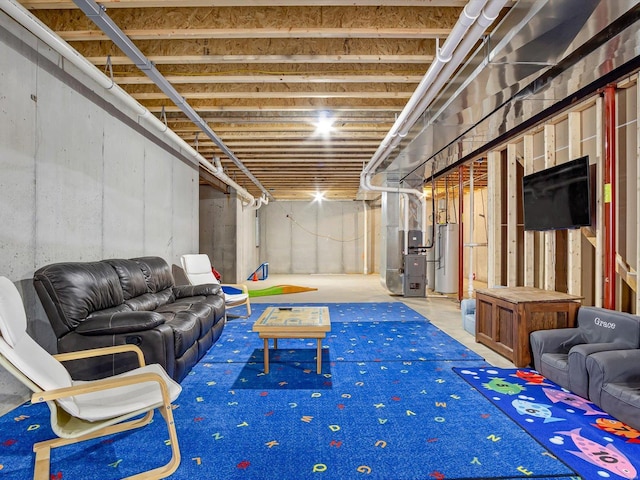 unfinished basement featuring heating unit and water heater