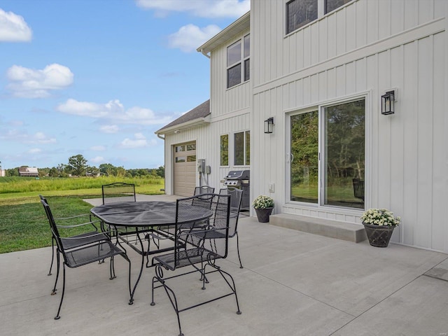 view of patio featuring outdoor dining space and grilling area