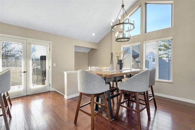 dining space with plenty of natural light, french doors, and hardwood / wood-style flooring