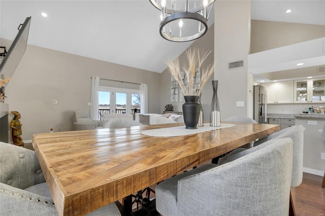 dining area with visible vents, high vaulted ceiling, dark wood finished floors, recessed lighting, and baseboards