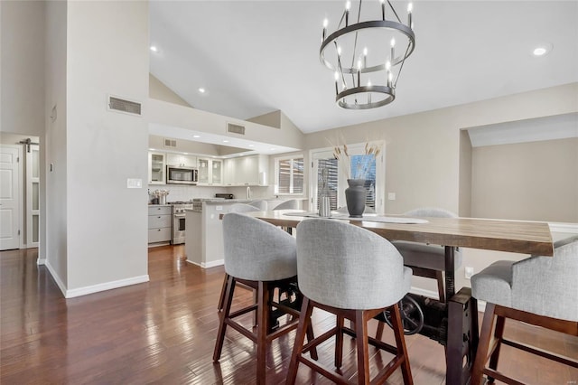 dining room featuring dark wood-style floors, visible vents, recessed lighting, and baseboards