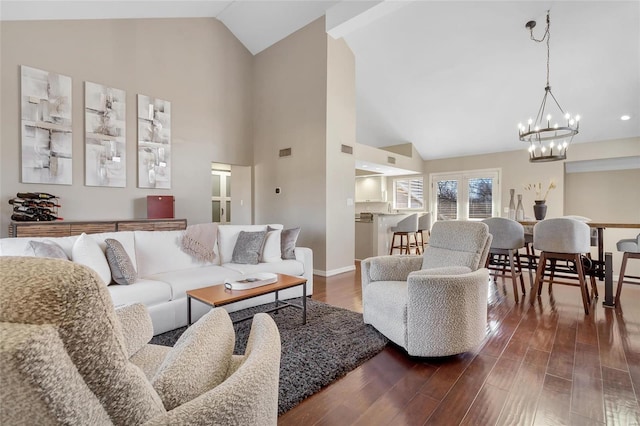 living area with high vaulted ceiling, baseboards, and dark wood-style flooring