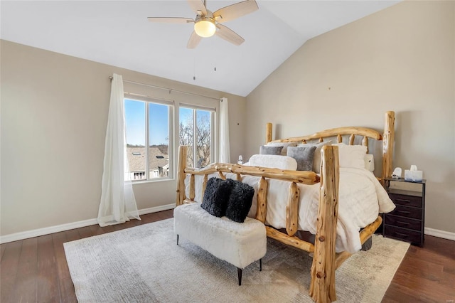 bedroom featuring vaulted ceiling, wood finished floors, baseboards, and ceiling fan