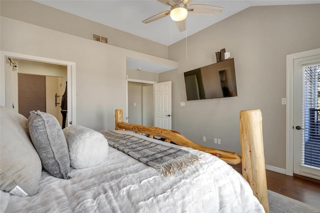 bedroom with visible vents, a ceiling fan, wood finished floors, baseboards, and lofted ceiling